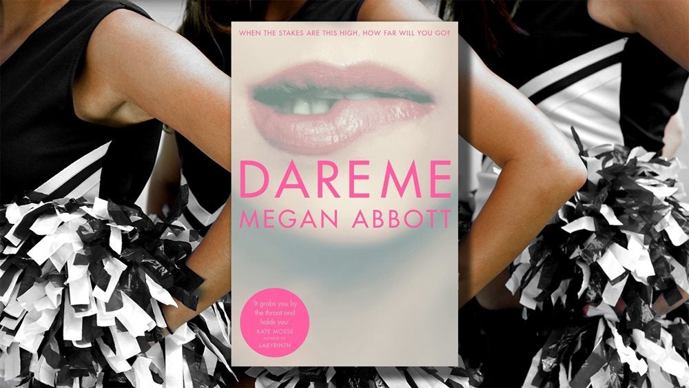 The jacket cover of Dare Me by Megan Abbott superimposed on a photo of cheerleaders
